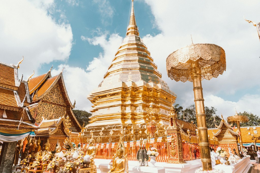 Gold and white temple building against the sky in Chiang Mai