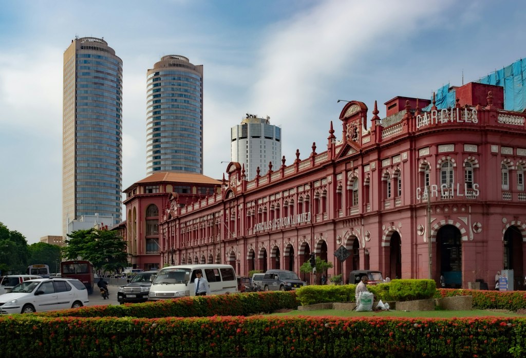 Red colonial building with a clock tower in Colombo, Sri Lanka