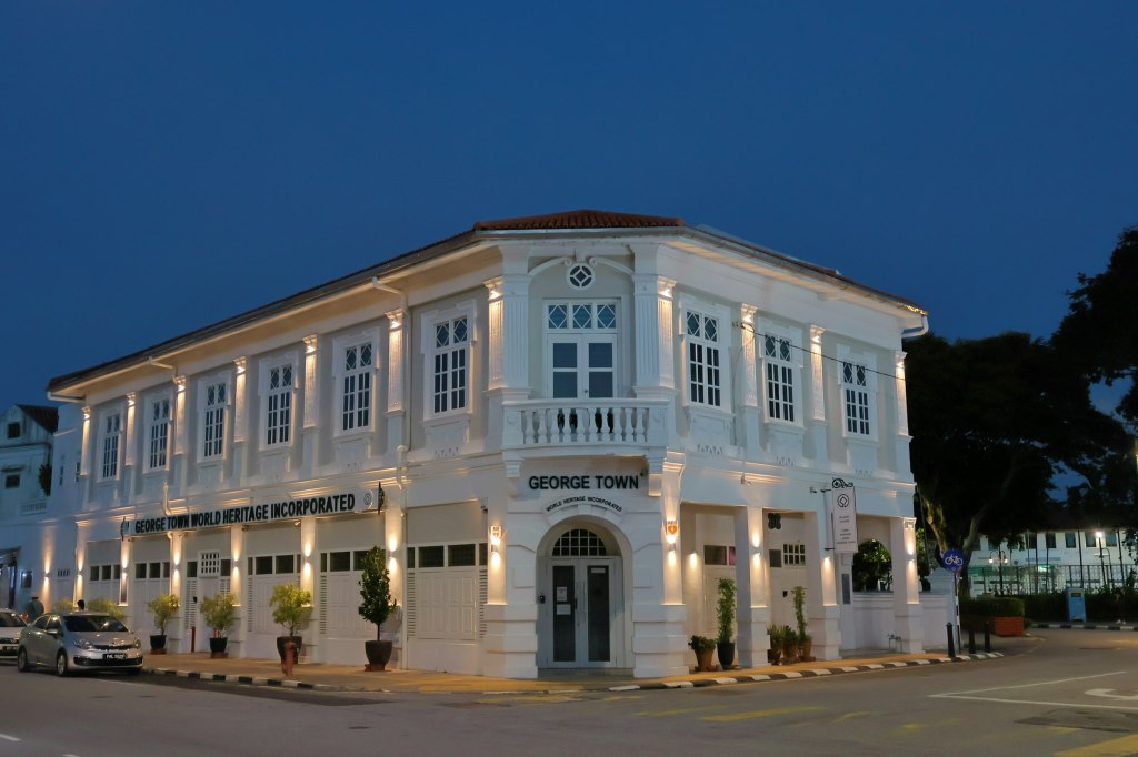 Historic colonial building lit at dusk in George Town, Penang, Malaysia