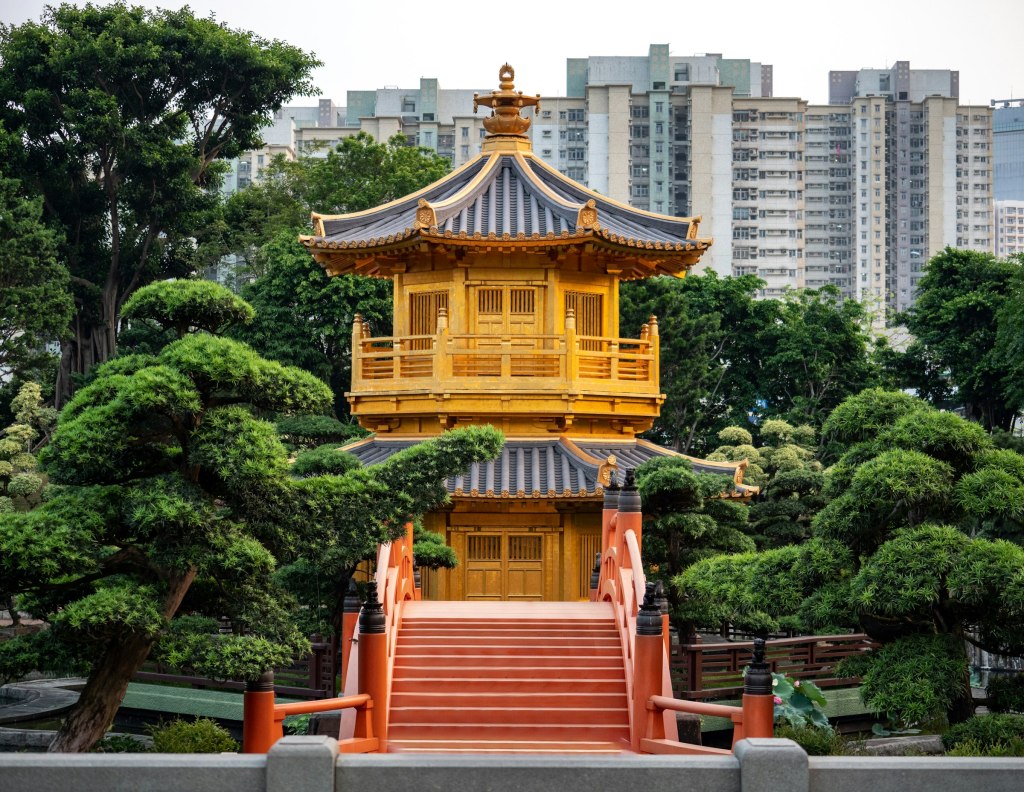 Brown and grey pagoda in a green park in Hong Kong