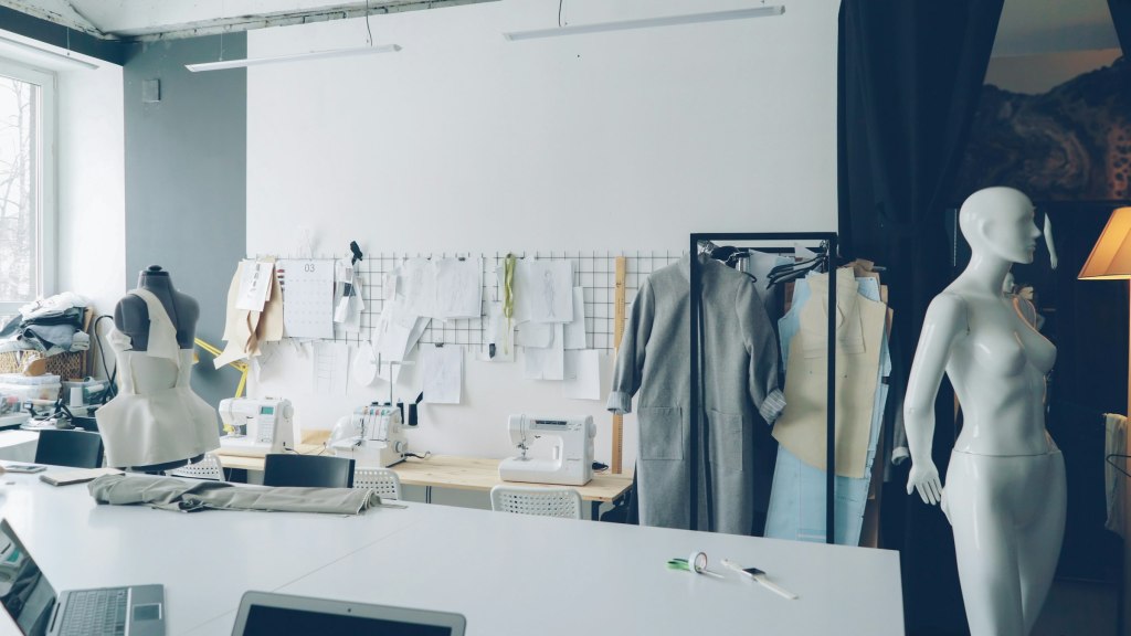 A tailoring studio with fabrics and sewing materials, evoking bespoke tailoring in Hong Kong