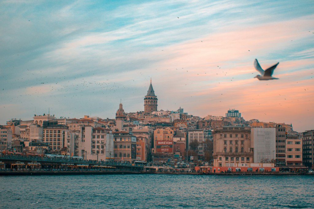 The Galata Tower rising above the Istanbul skyline at low sun