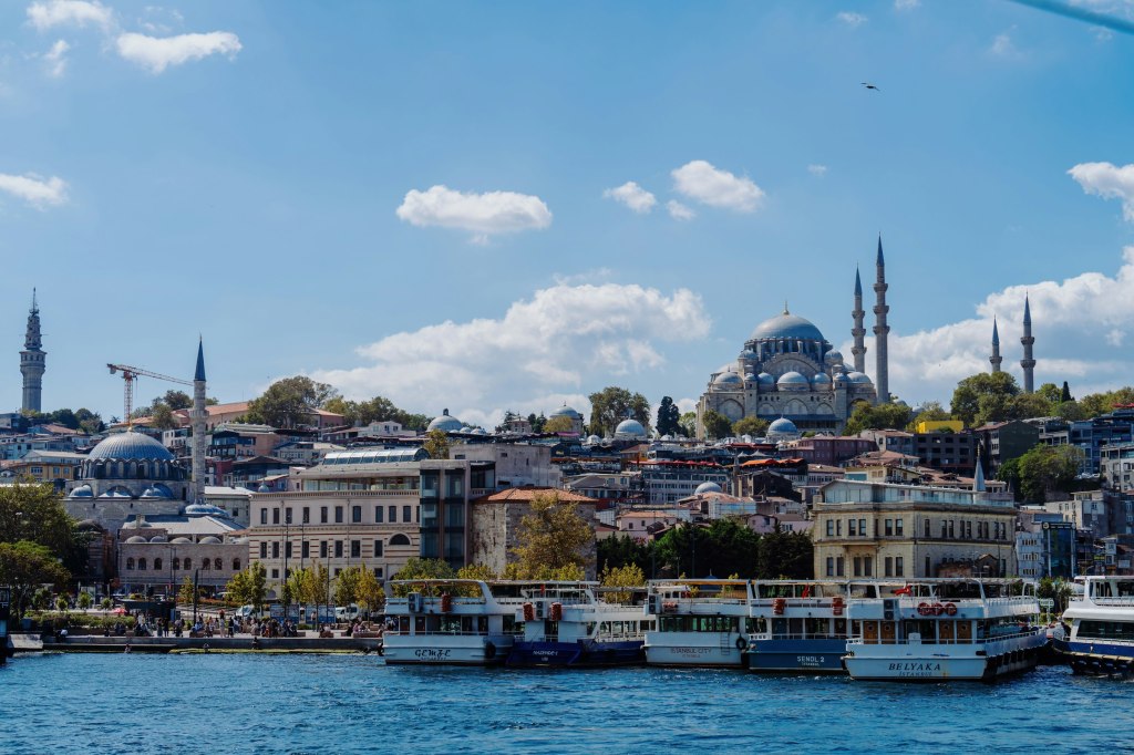 Istanbul skyline with mosques and boats on the water in Turkey