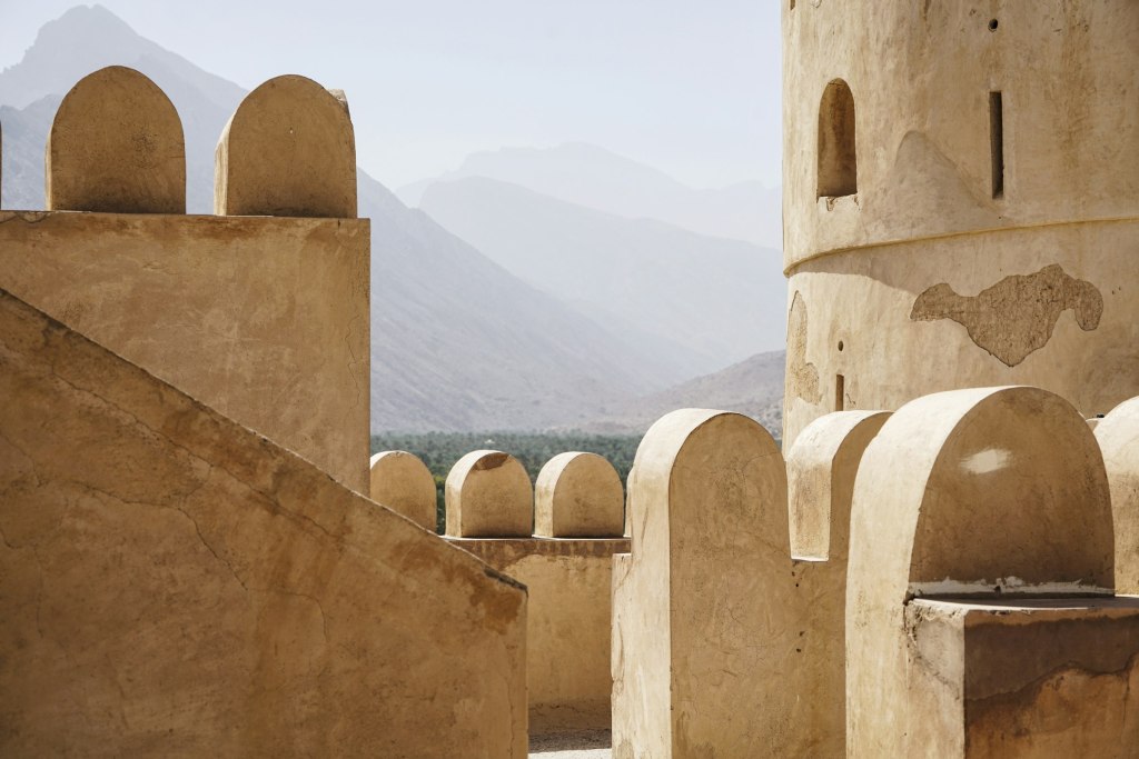 Stone fort architecture overlooking the Hajar mountains near Nizwa, Oman