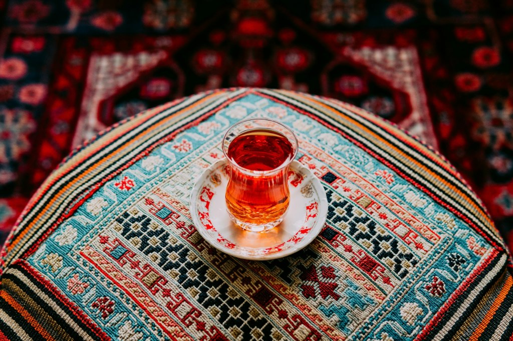 Black tea in a pear-shaped glass, central to Azerbaijani tea culture
