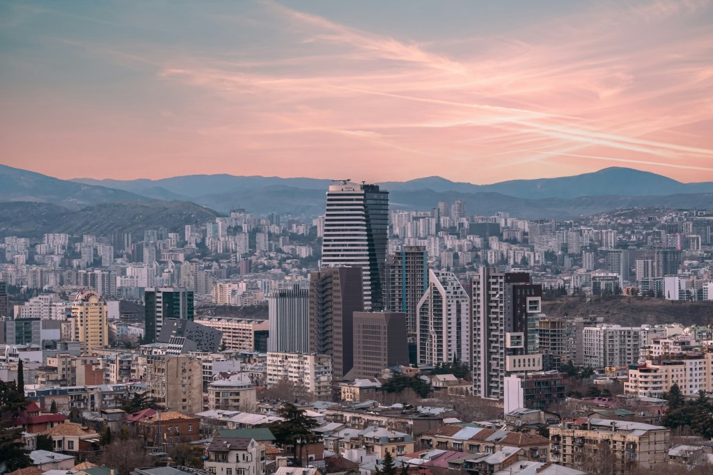 View over Tbilisi with mountains rising behind the city
